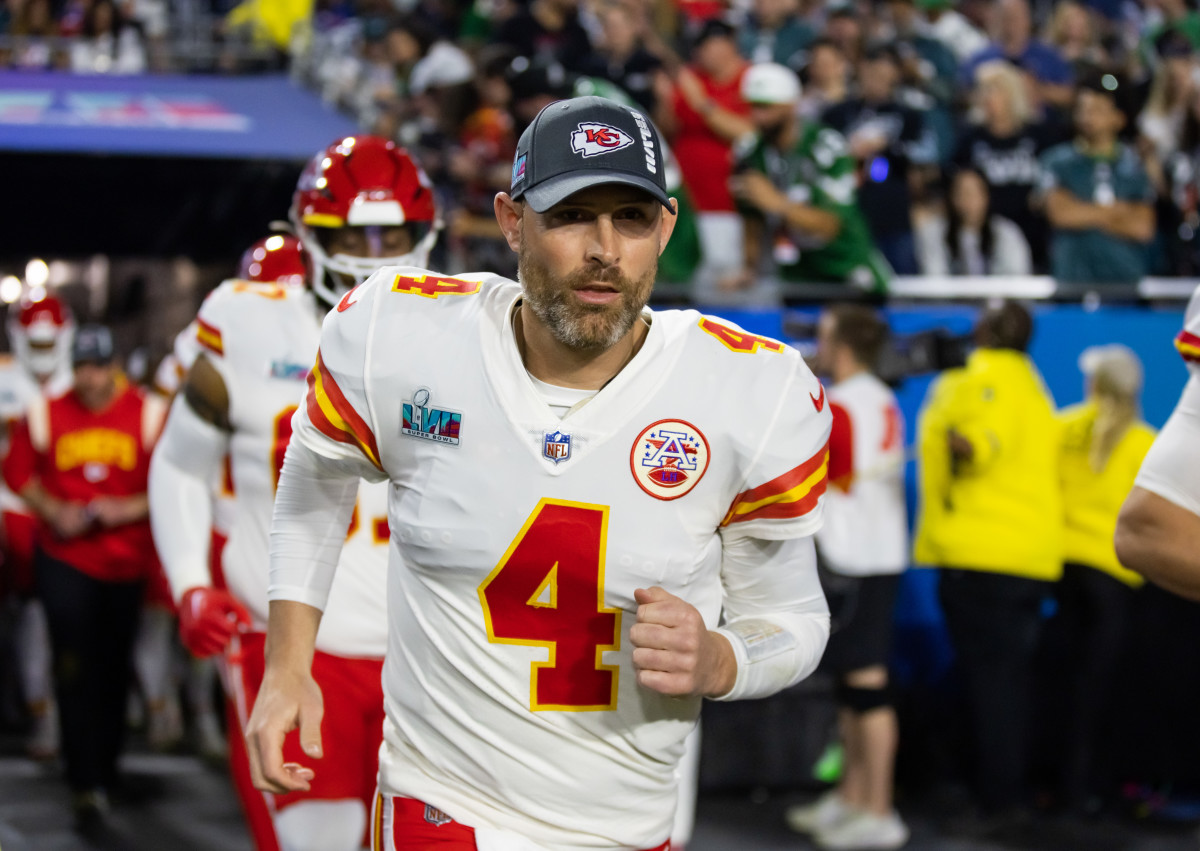 Chad Henne jogs onto the field before Super Bowl LVII